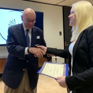 Scholar receiving certificate