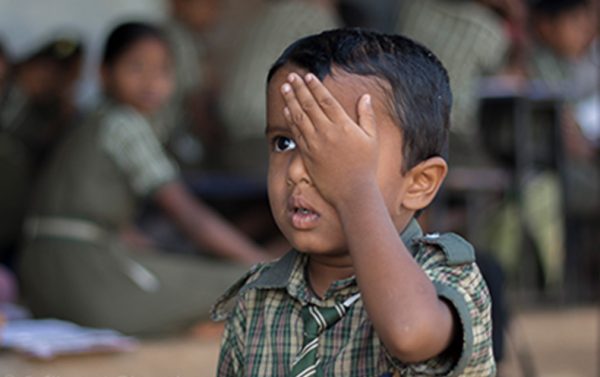 Young boy getting eye exam by LV Prasad Eye Institute.