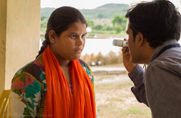 Girl receiving eye exam