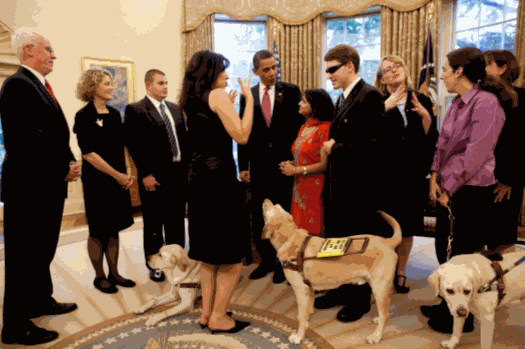 Young adults meeting President Obama in the Oval Office